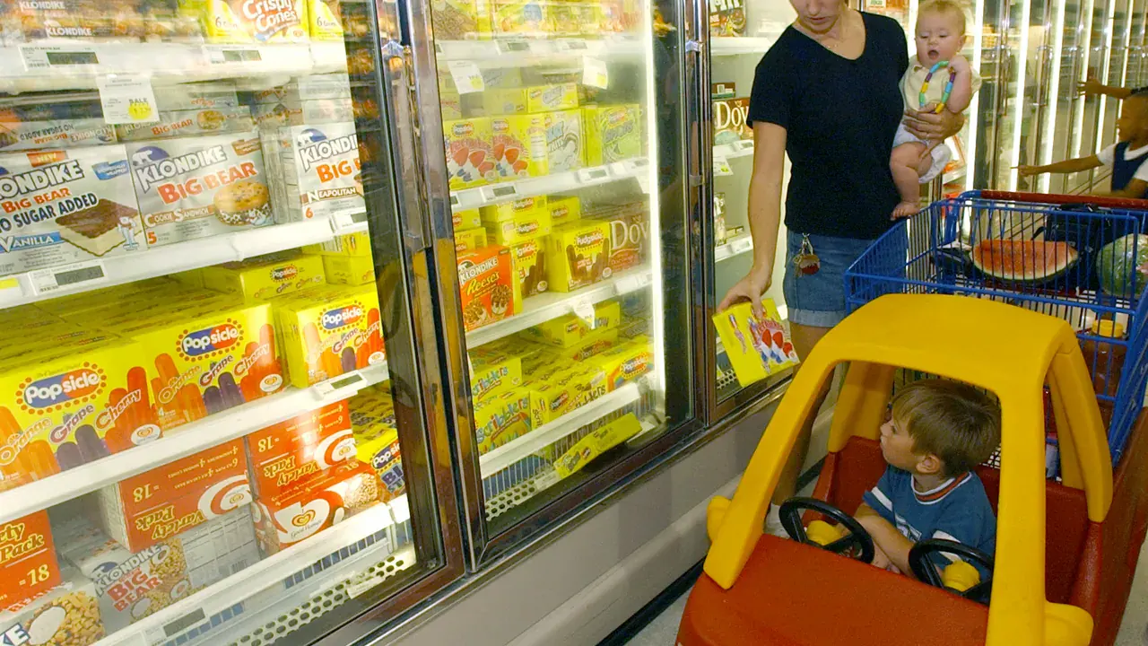 A shopper choosing groceries