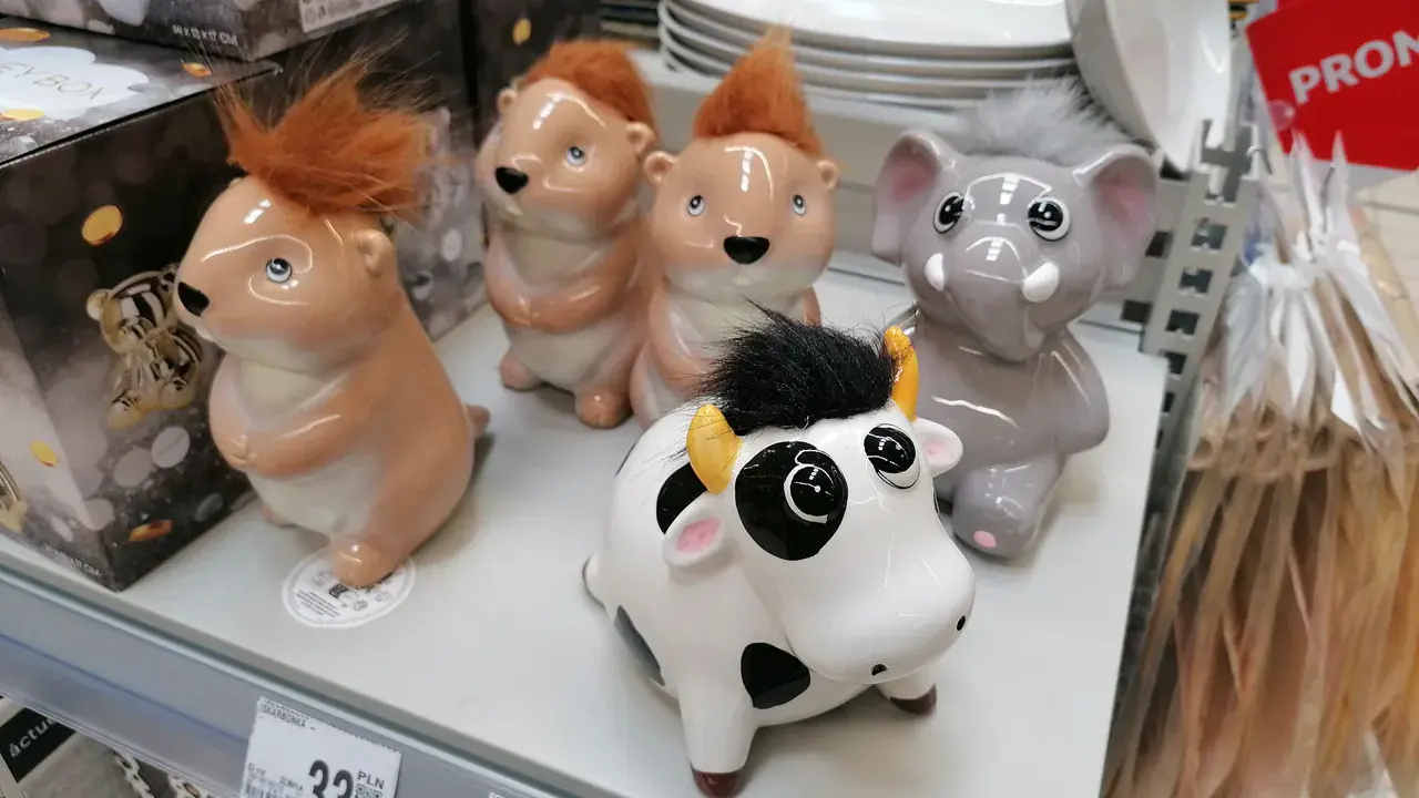 Ceramic piggy banks on a shelf