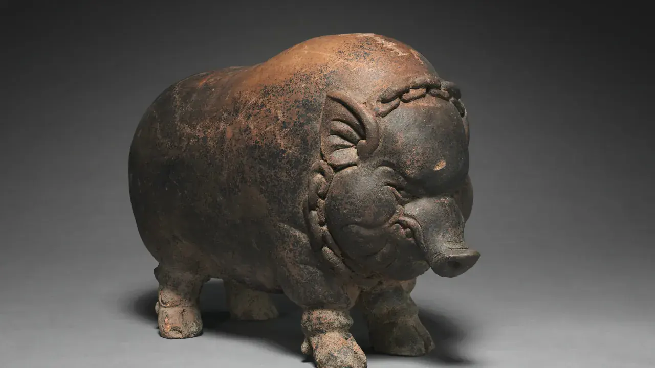 An antique terracotta piggy bank