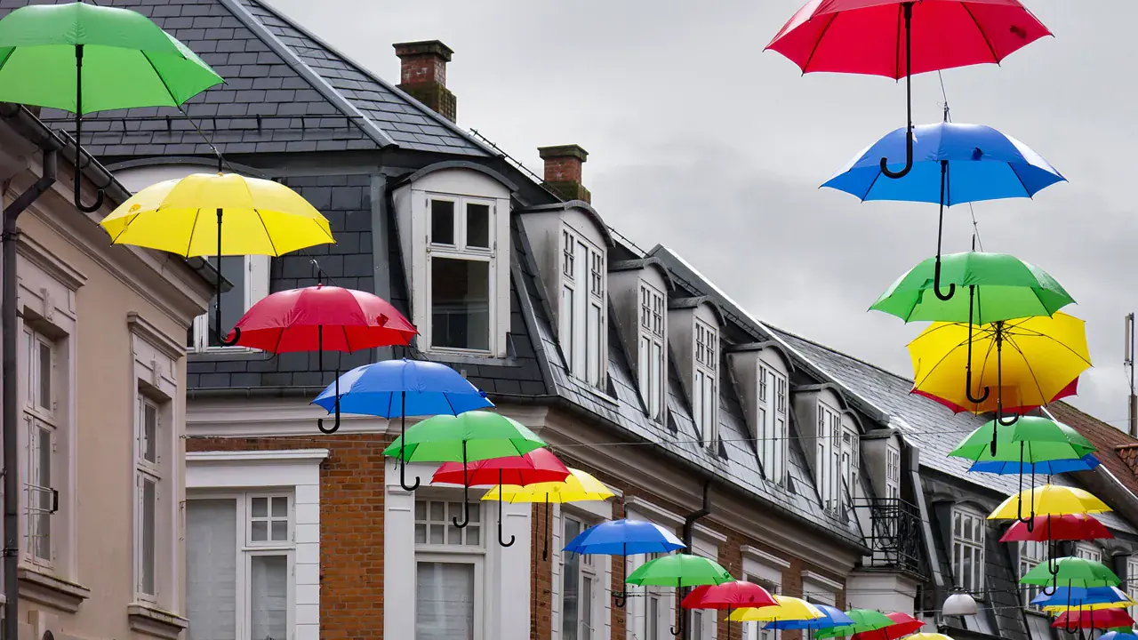 Colourful umbrellas strung over a street